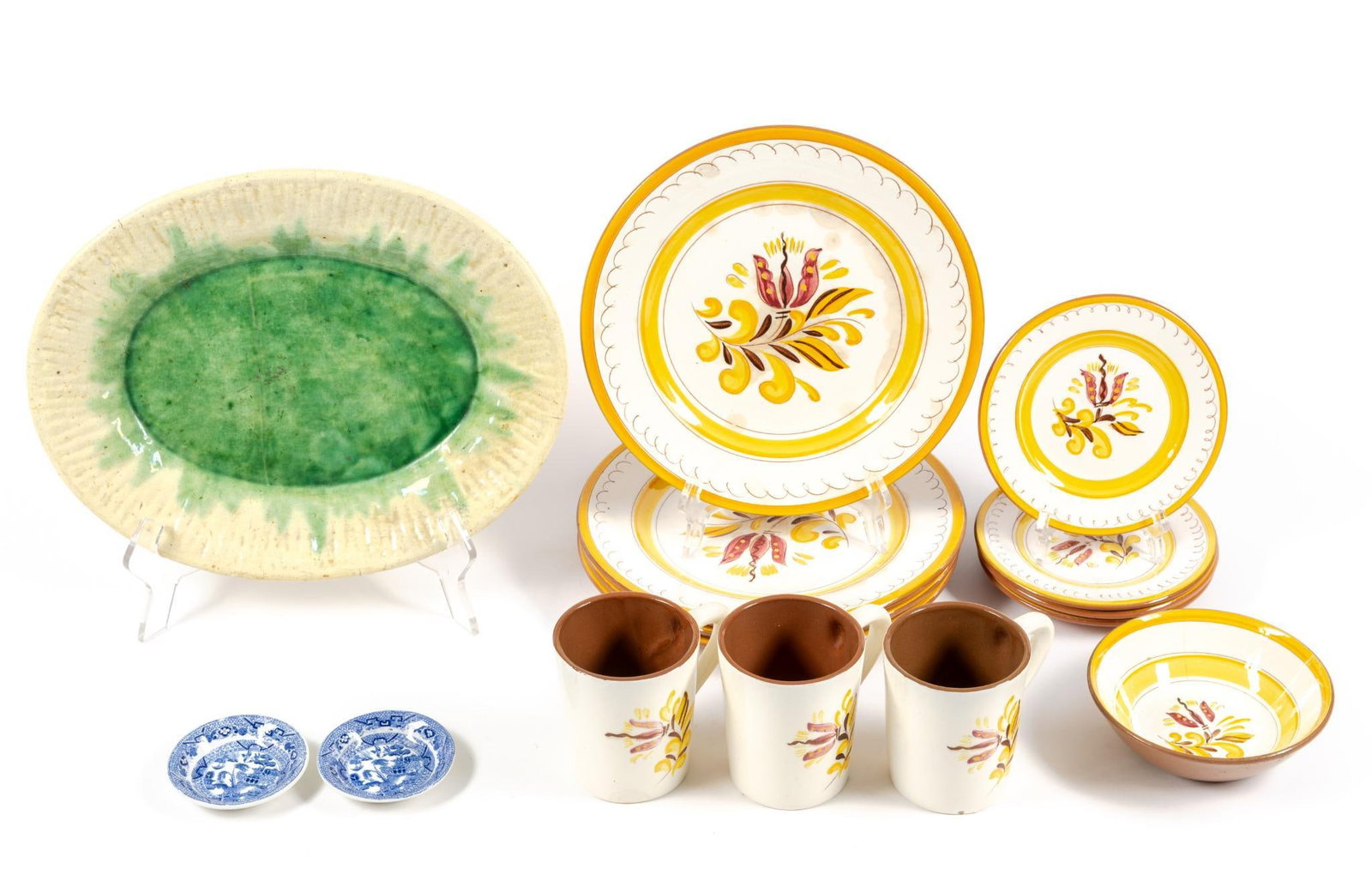Partial Stangl Pottery Set & Majolica Platter By Caldas Successor: Platter measures 10-1/2" x 13-1/4" and Stangl dinner plates are 10" in diameter. Plates and platter both have some discoloration and staining due to age and storage conditions. Also includes two blue