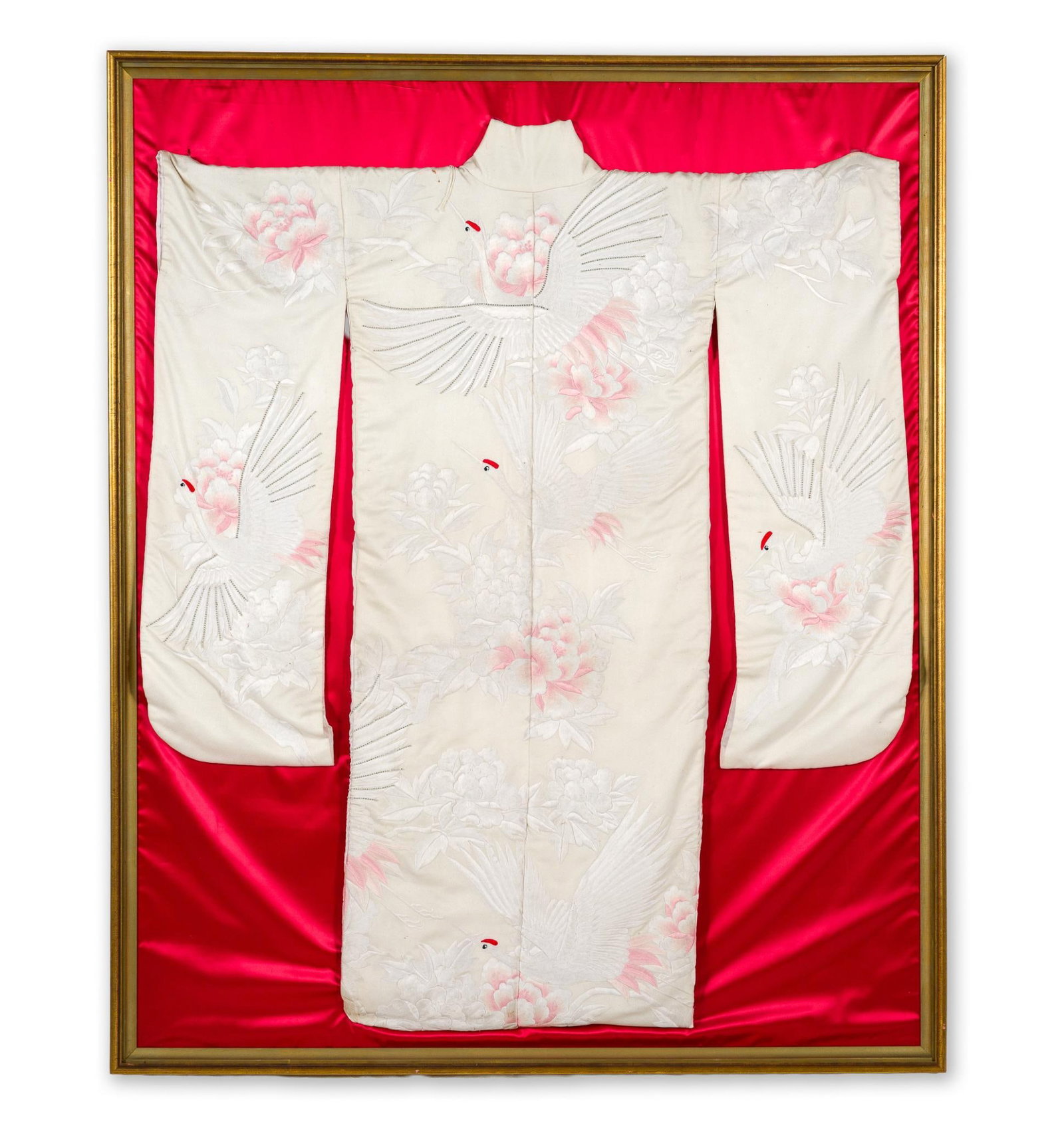 Japanese Silk Bridal Kimono in Display: Decorated with cranes and flowers. Pinned against red silk backing. Framed. Sleeve to sleeve 51-1/2" wide. Overall 71" high x 58" wide. 
