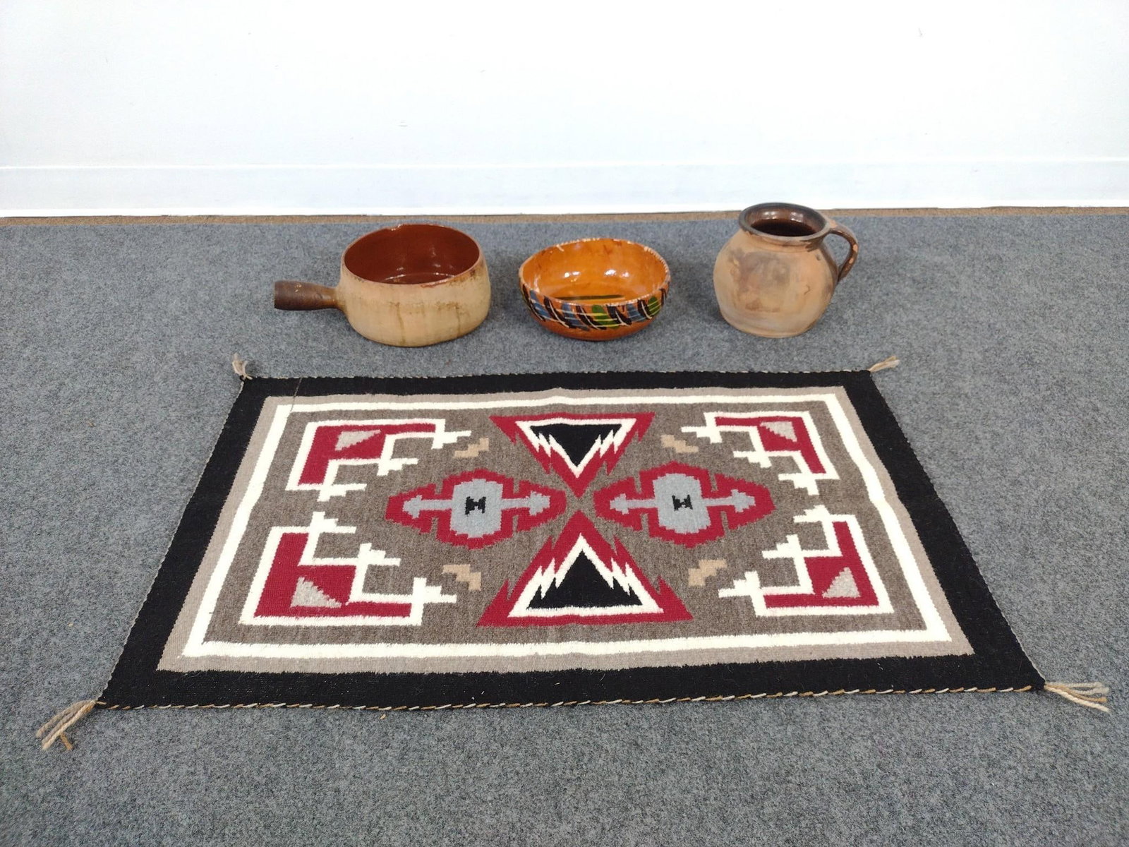 3 Pcs Pottery & Navajo Rug: One bowl marked Mexico. Rug measures 37" wide x 22" long. Pottery measures 7-1/4" to 9" wide x 4-1/2" to 6-3/4" high. 