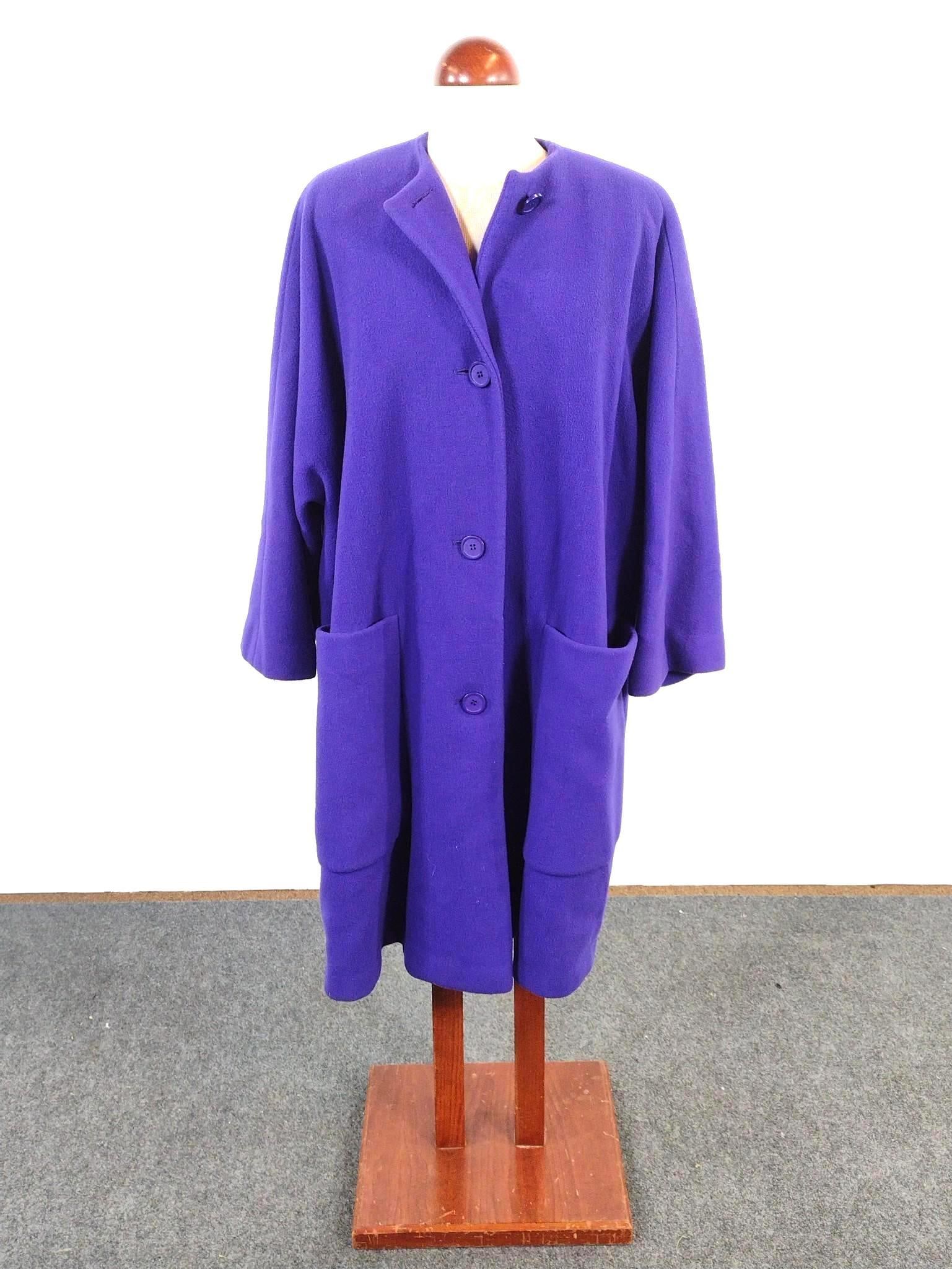 Saks Fifth Avenue Calvin Klein Coat: Shoulder to shoulder measures 17-1/2"; 44-1/2" long. Provenance: From the Estate of Lory Patrick Jones (1933–2026), actress, writer, director, and philanthropist known professionally as Lory Pat