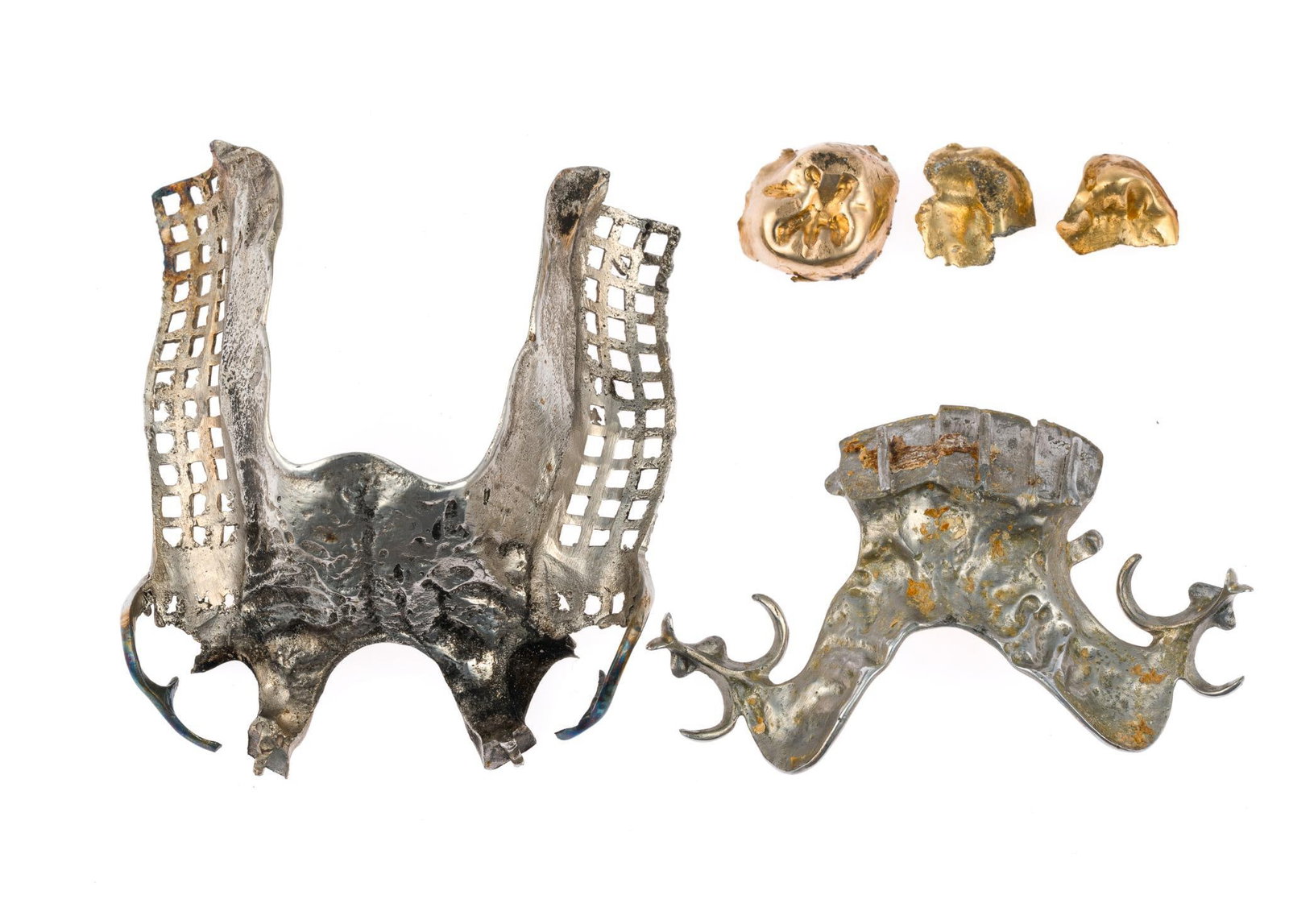 Dental Gold Scrap: Three crowns testing 18k weigh 6.5 grams. Two denture pieces weigh 20.8 grams and are unknown alloy.