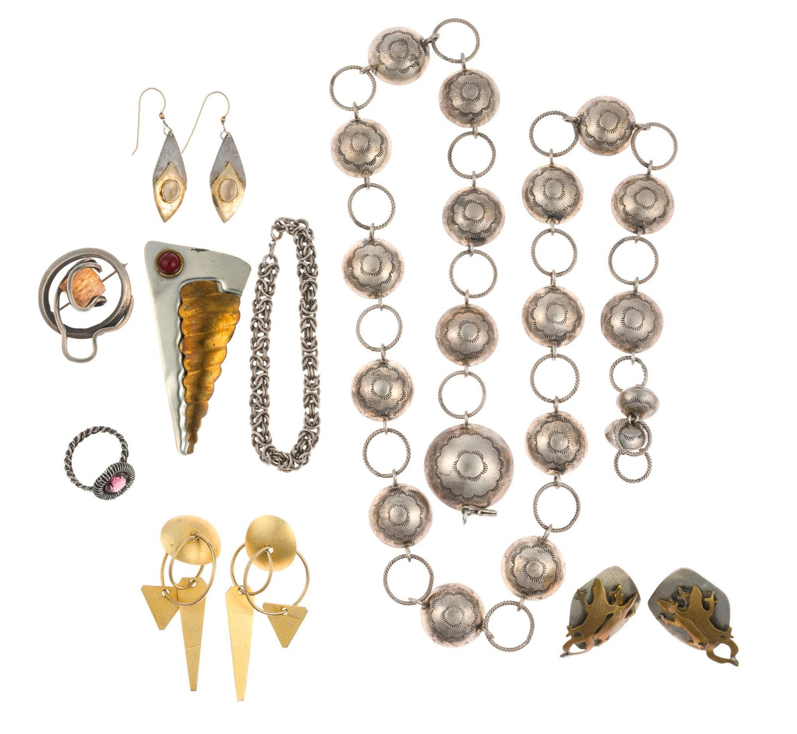 Jewelry Incl. Sterling Silver and 14K Gold: Most pieces appear to be silver but are unmarked. One pair of earrings in the form of leaf-shaped dangles have moonstone mounted to a patterned plate in 14k gold. The earwires are also 14k gold.