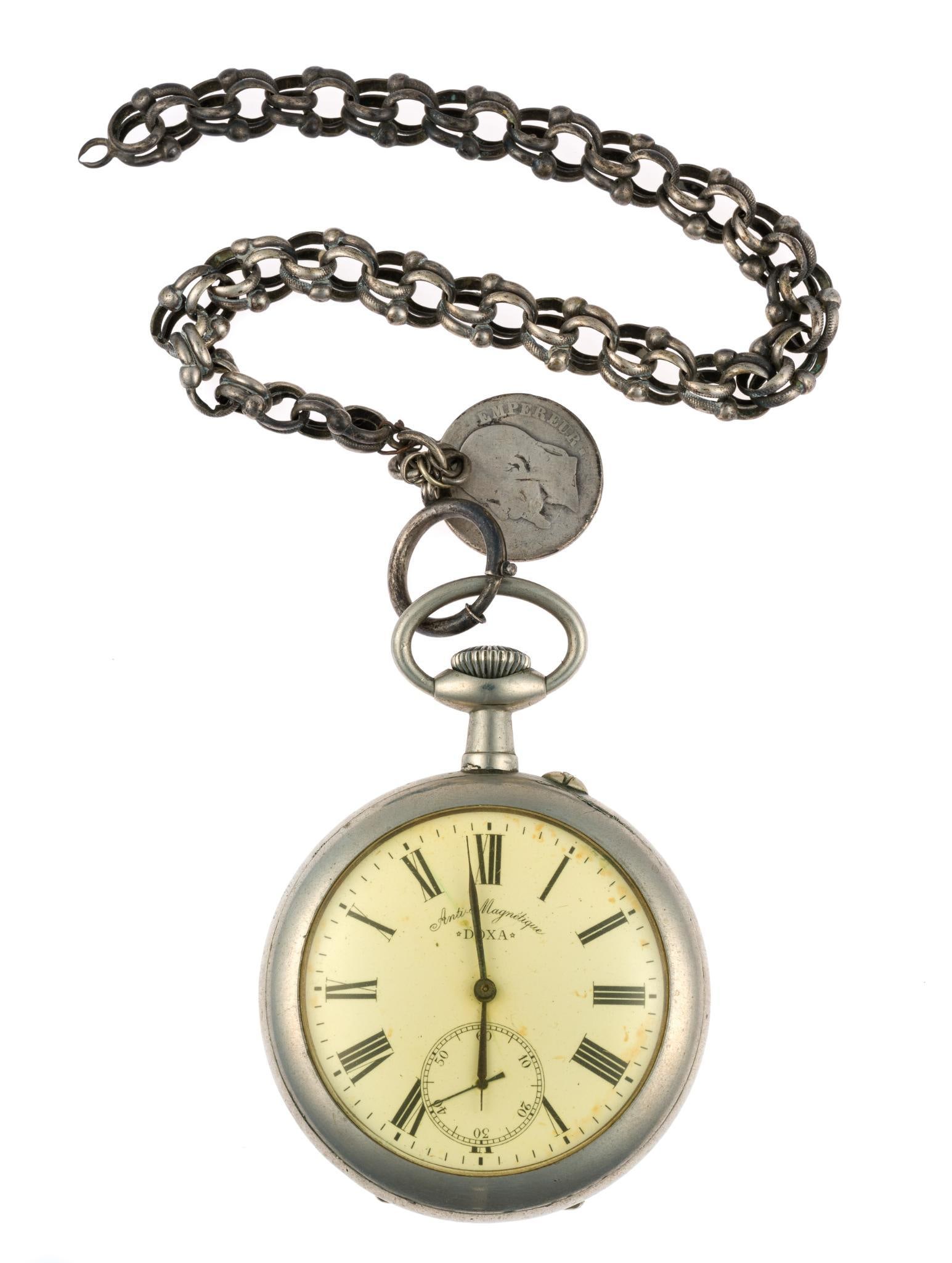Large 19th Century Doxa Pocket Watch: A very large (67mm diameter) Doxa Swiss open face pocket watch from approximately 1895. The watch sets and runs and has an excellent dial appearing yellowed due to the crystal. The watc