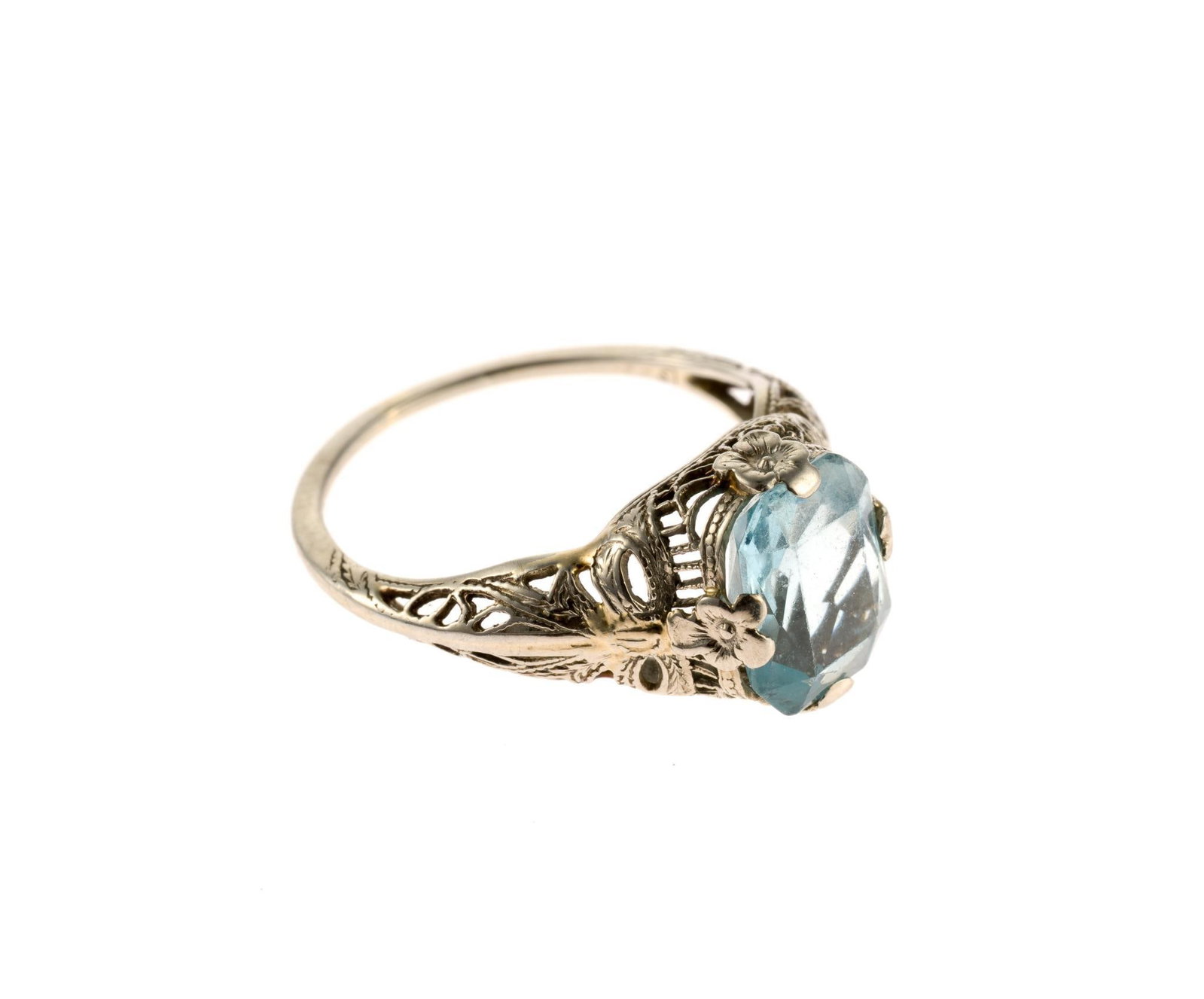 18K Gold and Gemstone Ring: A size 5.5 ring in white gold filigree with an oval faceted aquamarine. 2.2 grams. 