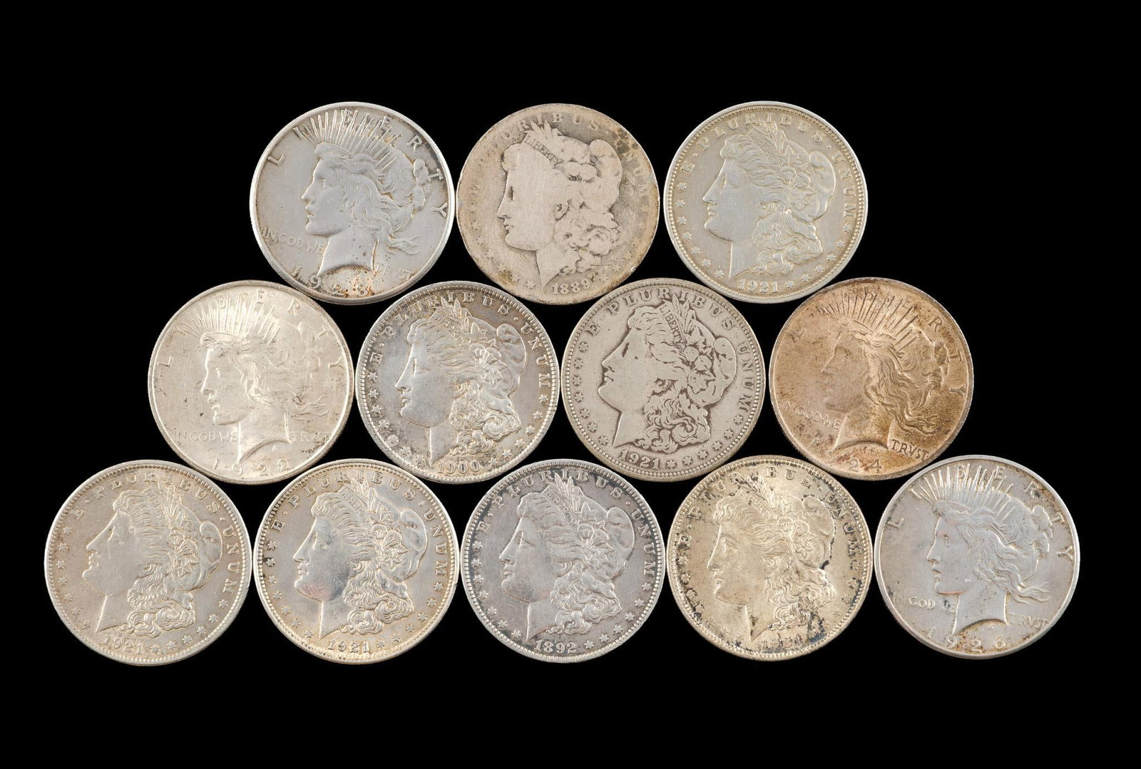 Twelve Silver Peace And Morgan dollars (1 of 2)