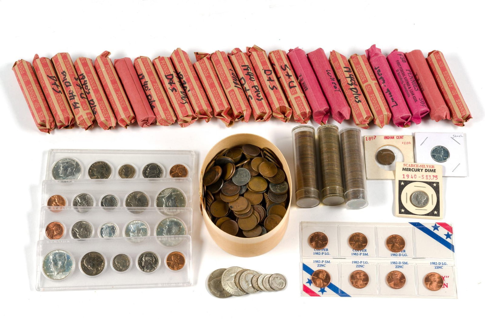 Wheat Cents And Silver Coins: Over 1500 Wheat cents in rolls and in a cannister. We have not examined the rolls except spot examination of the ends. For assembled mint sets 1964, 1965, 1967, 1968. Also a scattering of silver coins