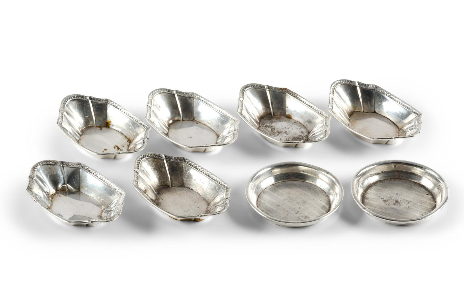 8 Sterling Silver Nut Dishes and Coasters: All marked. 2-1/8" to 2-3/4" long x 1/2" to 3/4" high. Total 3.71 ozt. 