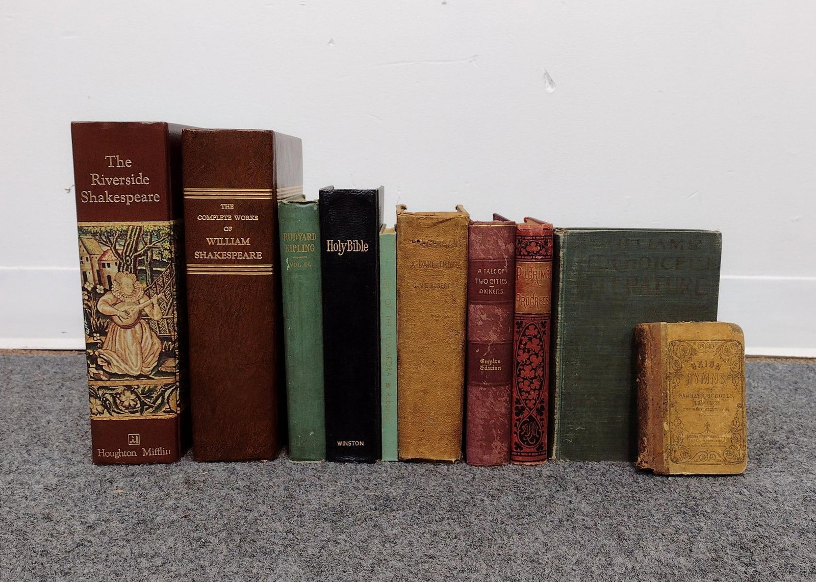 10 Antique & Vintage Books Incl. The Riverside Shakespeare & Pilgrims Promise: Pages have discoloration and boards are rubbed. Largest book measures 10-1/4" W x 8-1/2" D x 2-3/4" H. Smallest book measures 4-1/2" W x 3-1/8" D x 3/4" H. 