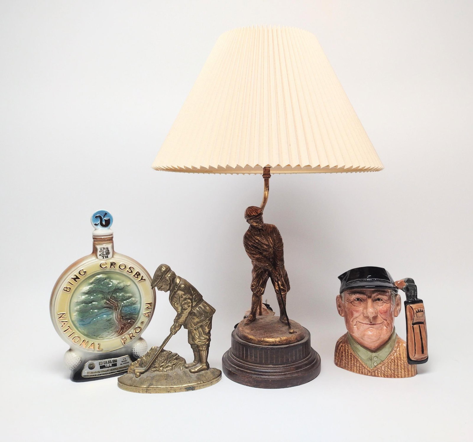 Figural Golf Lamp, Door Stop, Decanter & Royal Doulton Mug: Decanter experiences residue. Largest item measures 24" in height. 