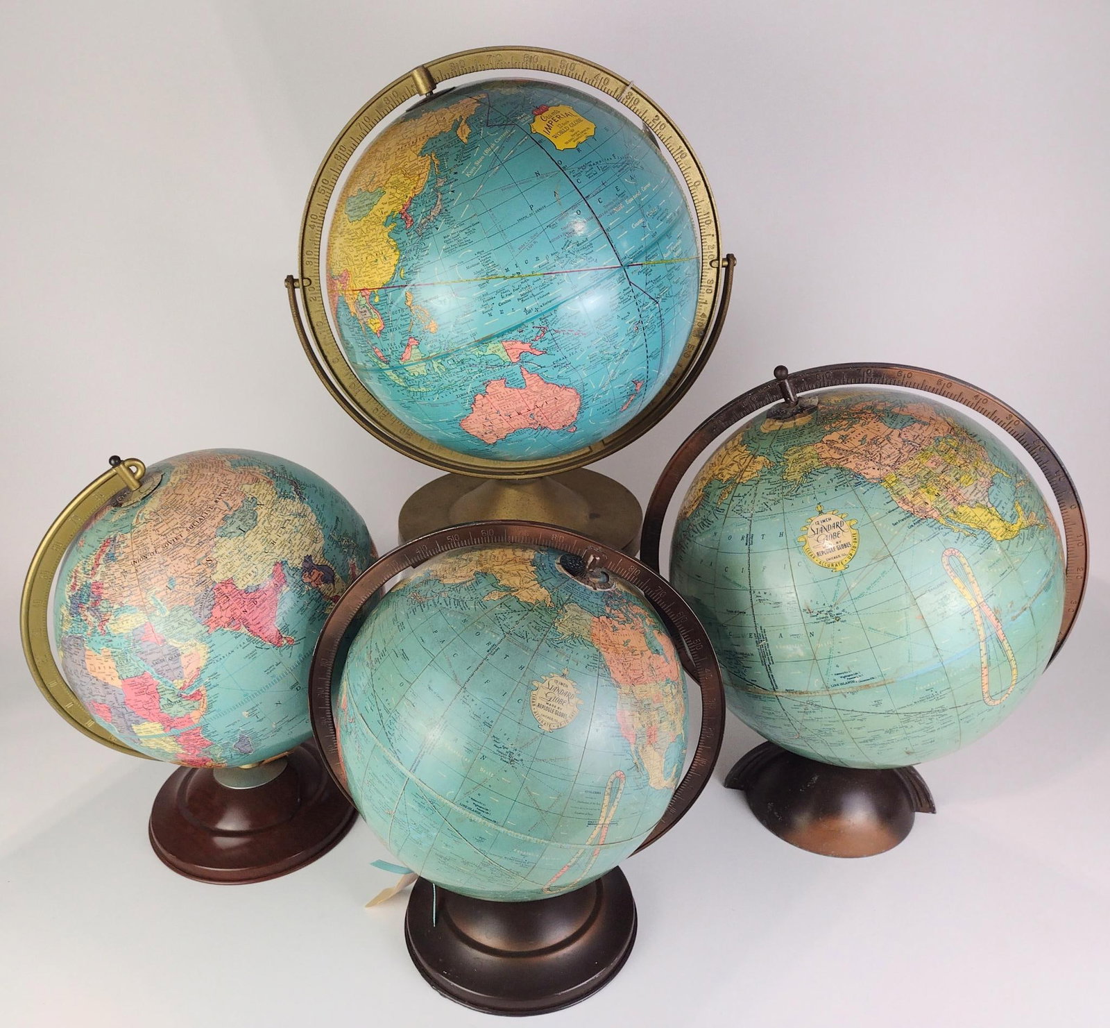 4 Vintage World Globes Incl. George F. Cram & Co.: Also includes Replogle Standard Globe. Two 12" diameter globes and two 10" diameter globes. 