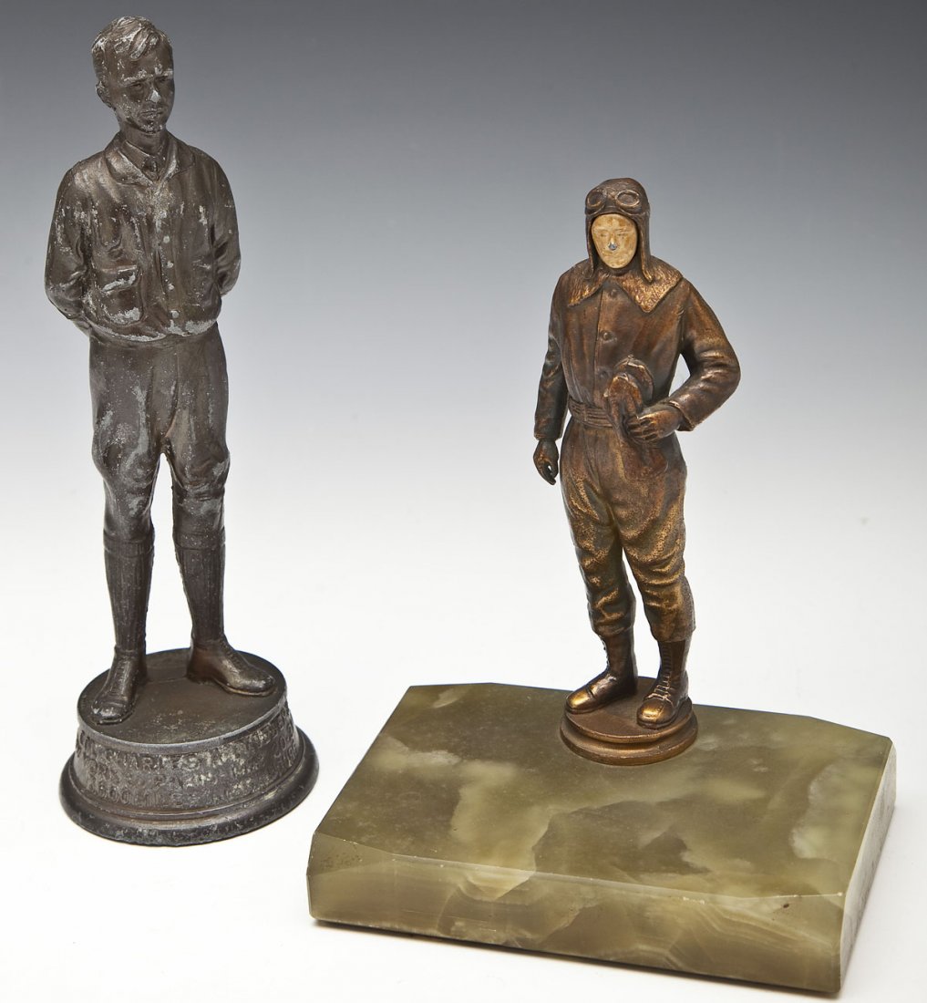 2 Small Charles Lindbergh Statues: DESCRIPTION: Two small statues of Charles Lindbergh. Includes: 1) 8-1/4" spelter full length statue. Marked to base "Col. Charles A Lindbergh New York to Paris - May 20-21-1927 3600 Miles in 33-1/2 Ho