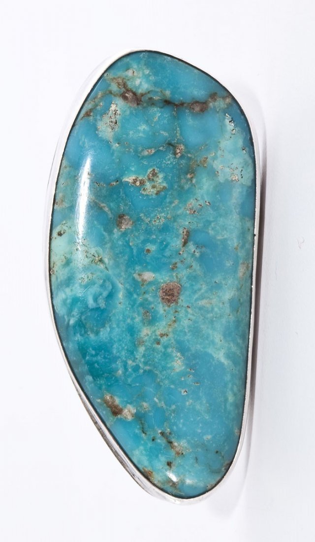 Signed Navajo Turquoise Ring: DESCRIPTION: Navajo silver ring set with large amorphic turquoise stone. Signed "JC Sterling". Top 1-1/4" x 1-1/8". Size 8.