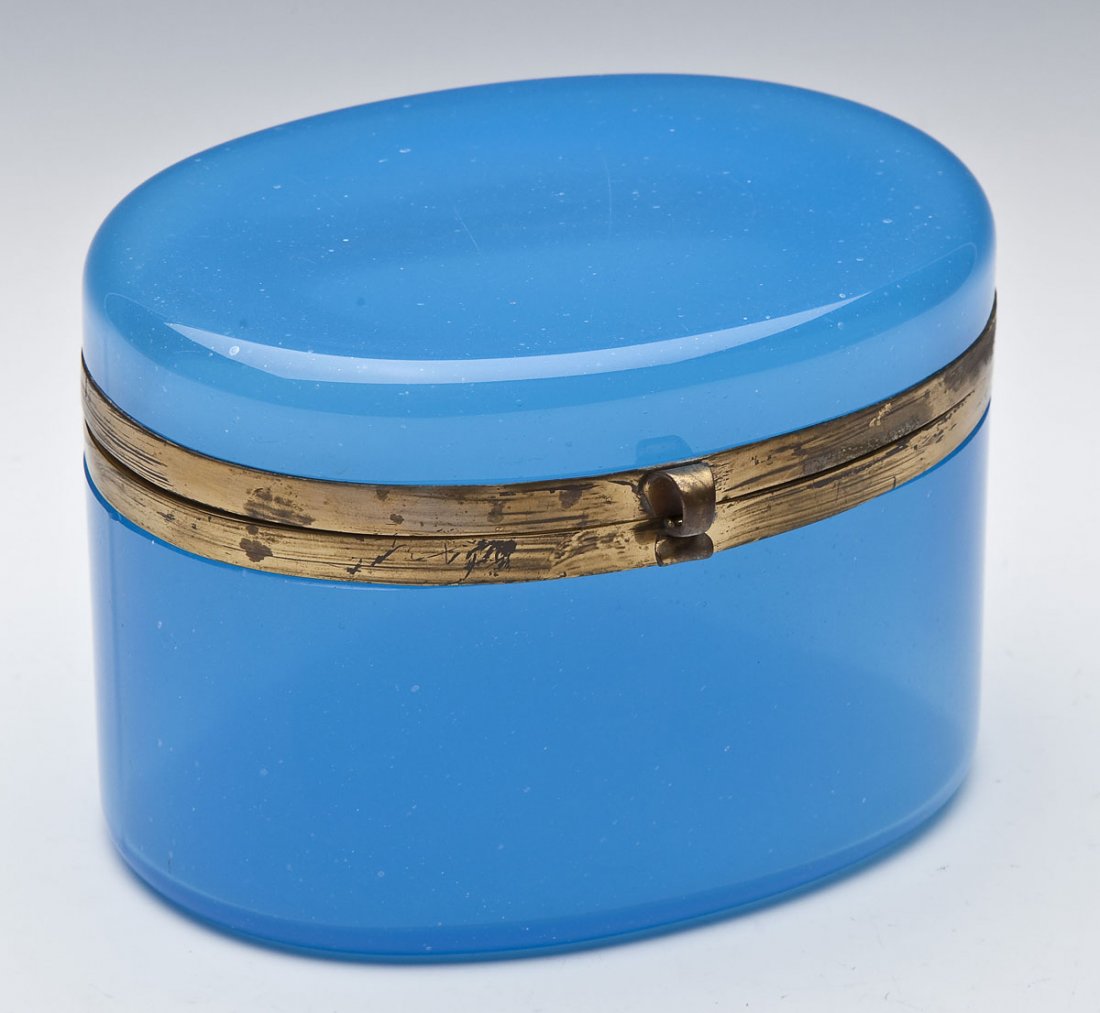 French Blue Opaline Glass Dresser Box: DESCRIPTION: French blue opaline glass dresser box. Oval with brass mounts. Unmarked. 19th century. MEASUREMENTS: 5-5/8" x 5" x 4" high. CONDITION: Minor scattered light scratches to lid and body.