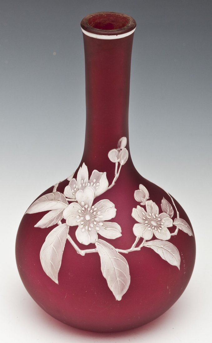 Thomas Webb Style Cameo Glass Vase: DESCRIPTION: Cameo vase in the style of Thomas Webb. Bulbous form having white floral cameo decoration and a red satin ground. Unmarked. 19th century. MEASUREMENTS: 7-1/2" x 4" diameter. CONDITION: So