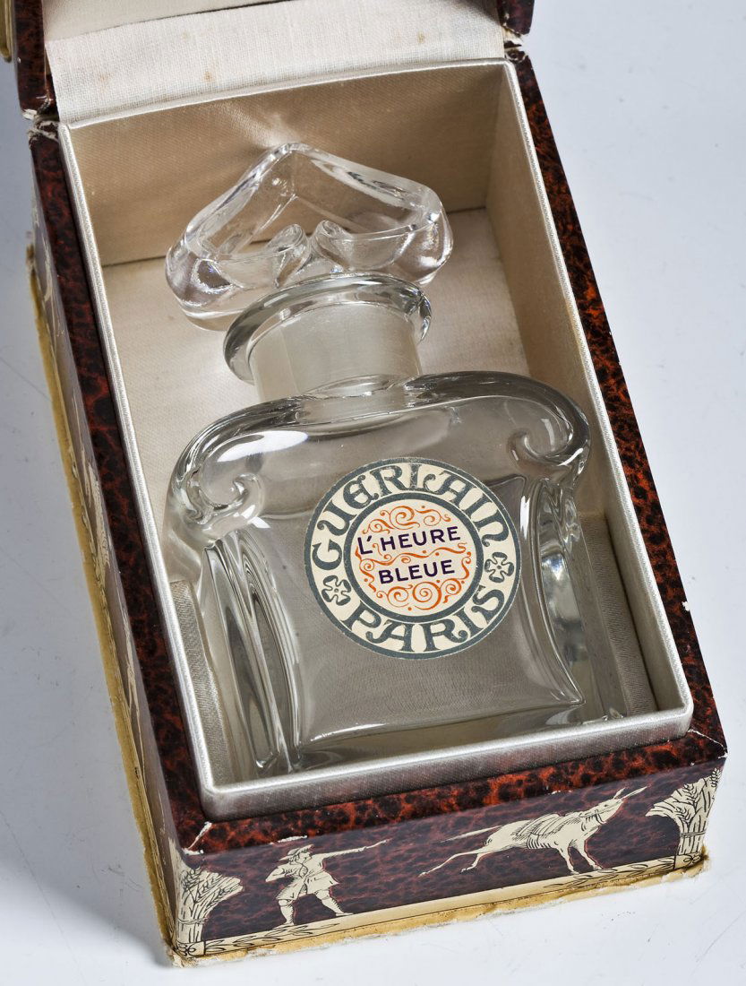 Guerlain L'Heure Bleue Perfume Bottle and Box: DESCRIPTION: Vintage Guerlain L'Heure Bleue French crystal fatice perfume bottle and Guerlain box. Label on front of bottle "Guerlain Paris L'Heure Bleue". Guerlain label on the bottom of the bottle w