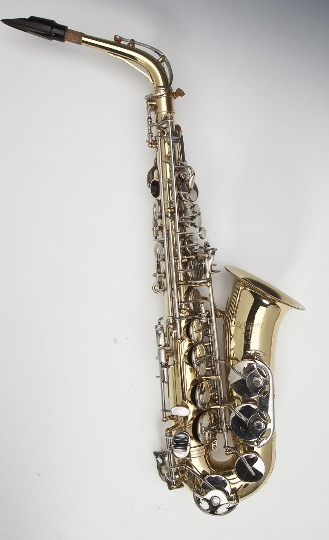 Selmer AS300 Saxophone: DESCRIPTION: Selmer AS300 saxophone with mother of parl keys. In orginal case with reeds and neckstrap. Serial No. 1312848. Marked " Selmer AS300 ® USA". Case with handwriting on it and cartoon in ce