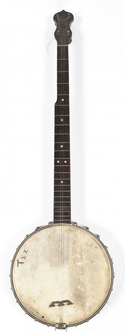 Washburn Banjo Style E: DESCRIPTION: Washburn Style E banjo. Marked on dowel stick "Style E Washburn 2080". Circa 1923 to 1925. MEASUREMENTS: 35-1/2" long. CONDITION: Missing some strings. Light soiling and writing to head.