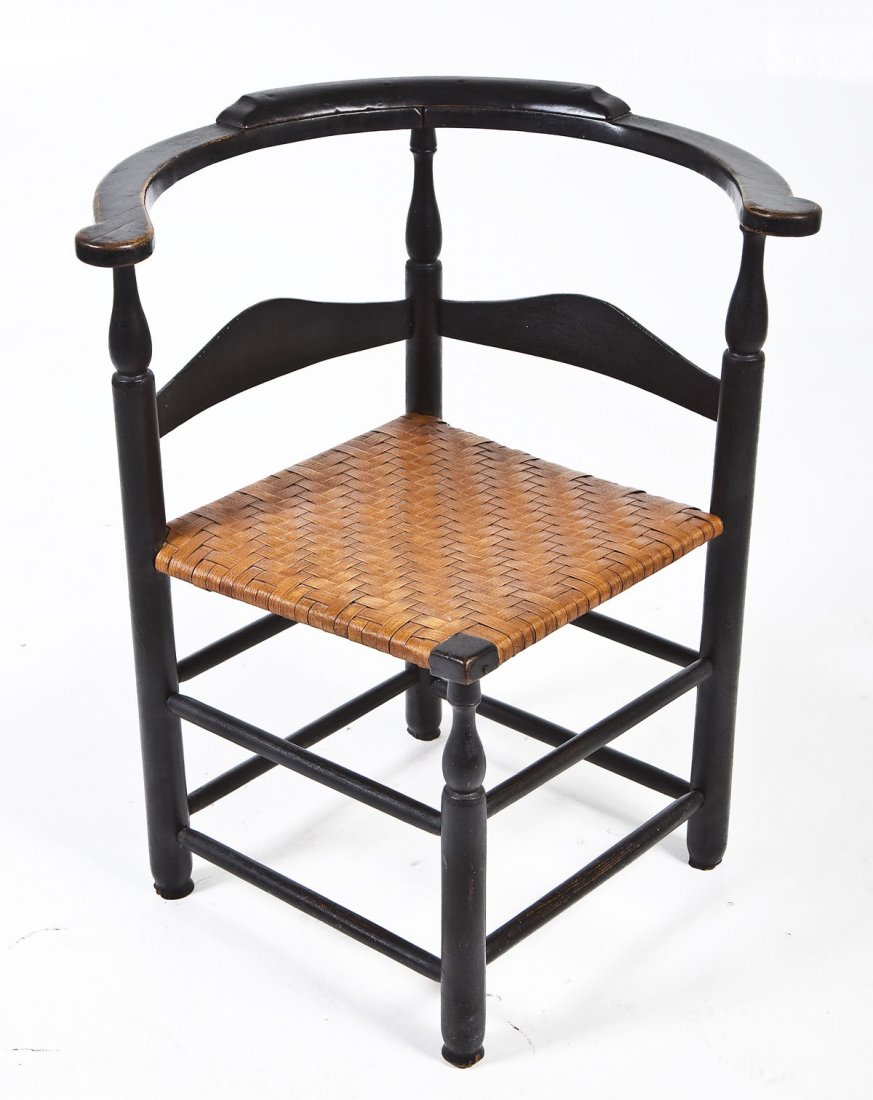 18th Century Chippendale Black Corner Chair: DESCRIPTION: A black painted (possibly oxidized green) late Chippendale corner chair consisting of a continuous crest rail supported by three turned urn spindles joining a frame with a later split sea