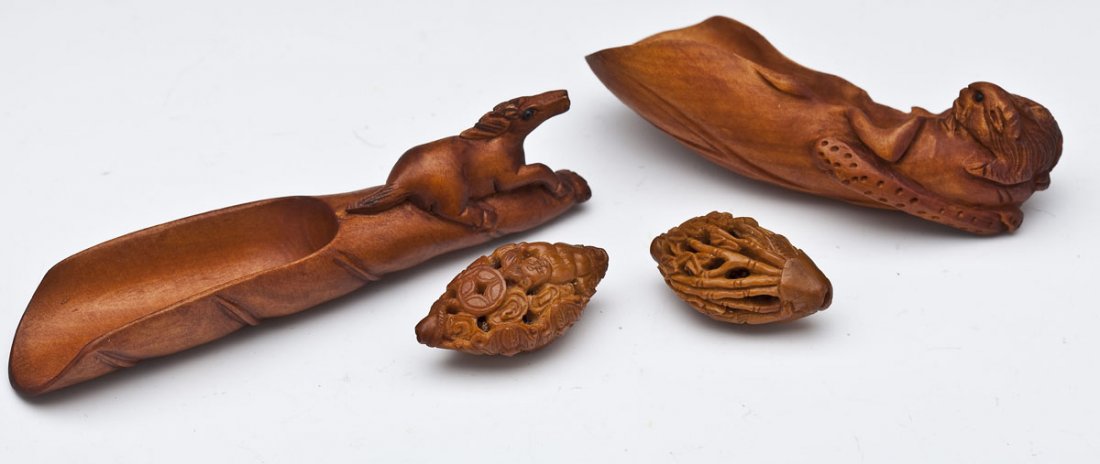 4 Chinese Carved Wood Netsukes: DESCRIPTION: Four Chinese carved wood netsukes. Includes: 1) Walnut carved with erotic scene. 1-1/4". 2) Walnut carved with figures and urn. 1-1/4". 3) Boxwood carved with horse and scoop. 4". 4) Boxw