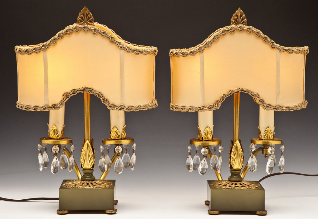 Pair of French Boudoir Lamps: DESCRIPTION: Pair of French boudoir lamps with shades. Two light, each with five prisms hanging from the base. Gold with leaf and ornate motif on an olive green base. MEASUREMENTS: 17-1/2" x 11" x 5".