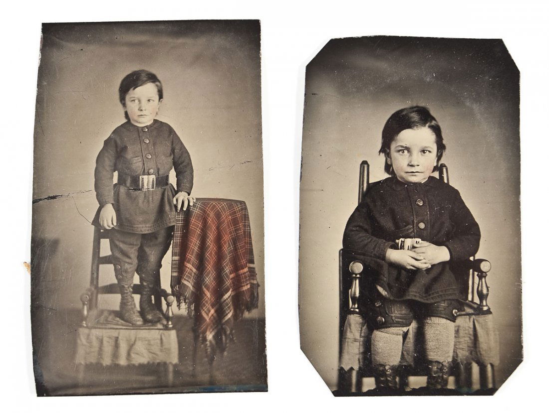 2 Tintypes of Boy in Uniform: DESCRIPTION: Two 19th century tintype photographs of a little boy dressed in a uniform with belt and boots with hand tinting. MEASUREMENTS: 2" x 3-1/4". CONDITION: Image of boy standing with very mino