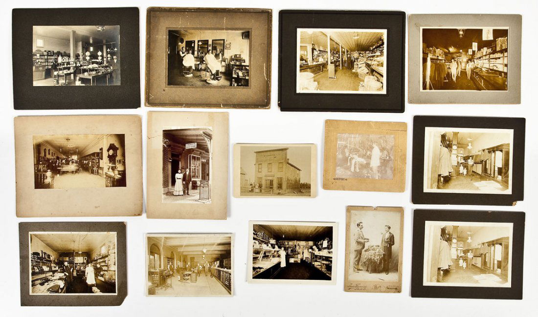 14 Antique Occupational Photographs of Stores: DESCRIPTION: Group of fourteen antique occupational photographs including barbers, tailors, shoe stores including Henderson & Co. Boots & Shoes, country stores, clothing and gloves, and clock and jewe