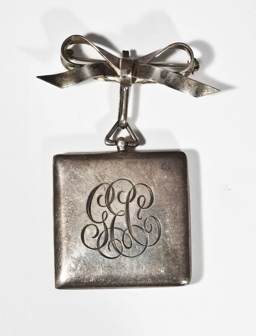 Sterling Locket Pin: DESCRIPTION: Marked sterling locket on bow pin. The front is engraved "GEC". 1-1/4" square. 14.1 dwt (21.8 gr).