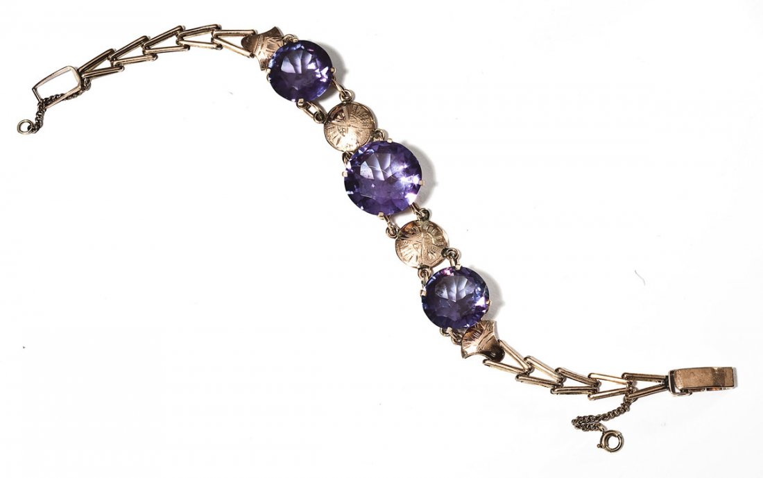 9K Peach Gold & Alexandrite Bracelet: DESCRIPTION: Marked 9K peach gold bracelet set with three round simulated alexandrite stones. 7-1/2 inch length. 11.6 dwt (18.0 gr).