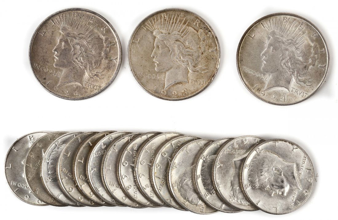 17 Silver Coins: DESCRIPTION: Twenty silver coins including 14 40% Silver Kennedy Halves, 1923 and 1924 (2) Peace Silver Dollars.