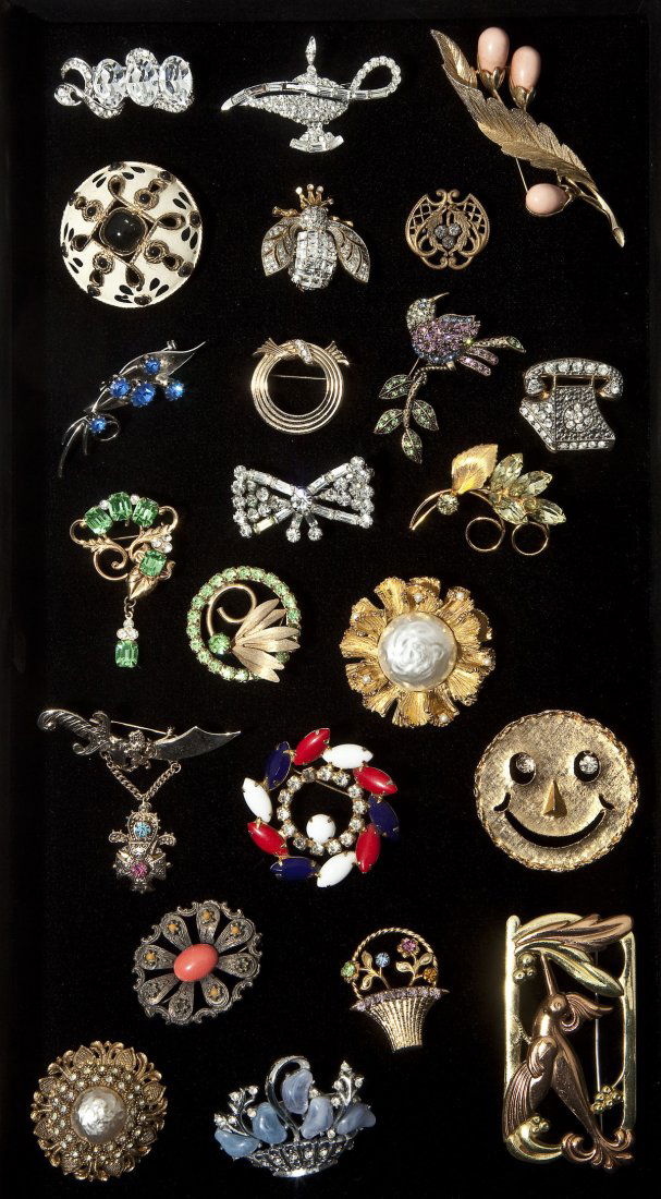 23 Fashion Pins: DESCRIPTION: Twenty-three fashion pins including Castle Cliff, Sarah Coventry, Joan Rivers, Avon, and Coro. 3/4" to 2" long.