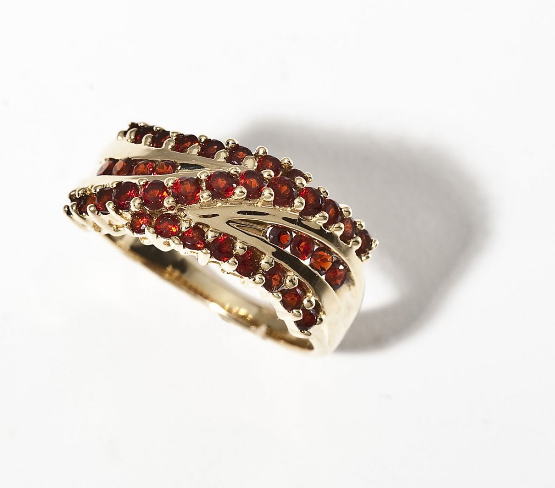 14K & Garnet Ring: DESCRIPTION: Garnet ring in marked 14K yellow gold. Set with thirty-seven 3 to 4 point round garnets. Size 7. 3.2 dwt (5.0 gr).