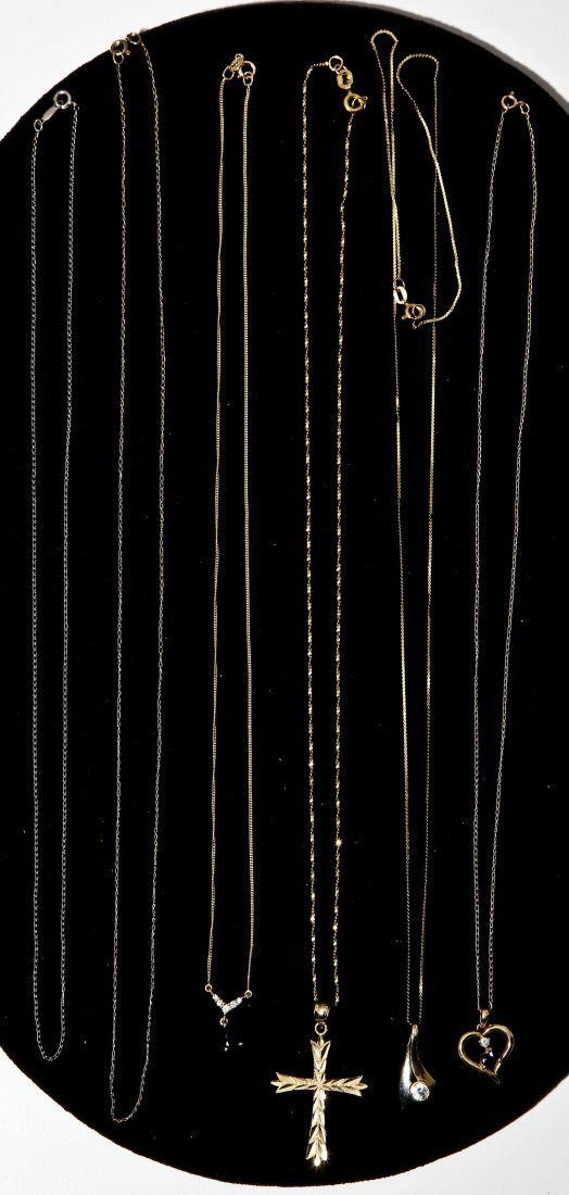 6 14K Gold Necklaces: DESCRIPTION: Six 14K gold necklaces. Includes: four pendants with chains (three with stones) and two chains (one yellow gold and one white gold). 6.2 dwt (9.7 gr) total with stones.
