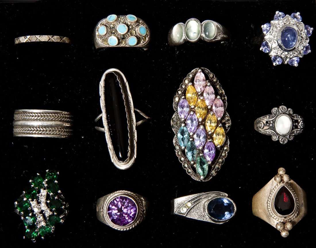 12 Silver & Sterling Rings: DESCRIPTION: Twelve silverrings. Including ten marked sterling (925).