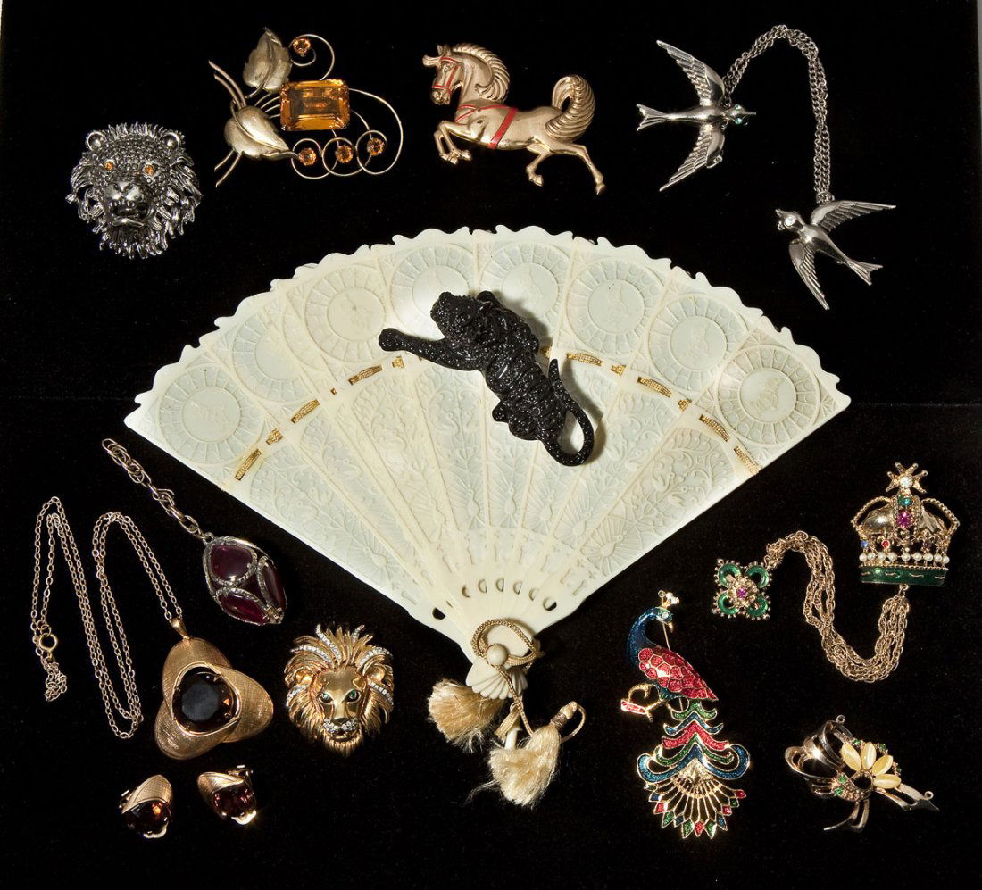 12 Pieces of Fashion Jewelry & Fan: DESCRIPTION: Twelve pieces of fashion jewelry. Including one piece marked 10K gold filled, black rhinestone panther pin and one Trifari. Together with a 7" ivory plastic fan. 1" to 9" long.