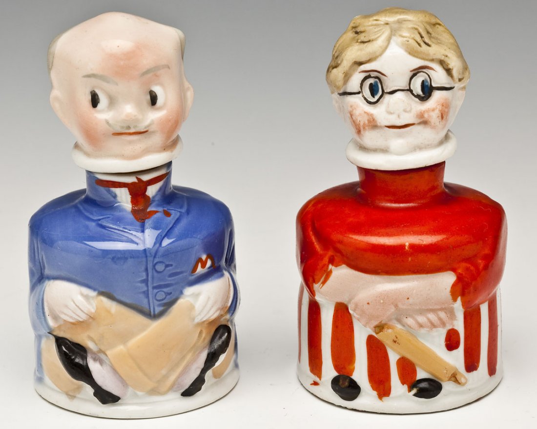 2 Carter's Figural Ink Bottles: DESCRIPTION: Two figural Carter's ink bottles in the form of a man and a woman. Each marked to back "Carter's Inx". Stamped to bases "Made in Germany." MEASUREMENTS: 3-3/4" high. CONDITION: Very minor