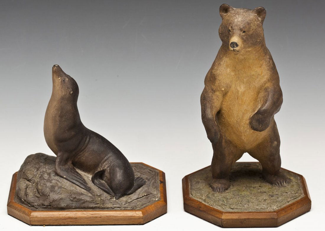 2 Louis Hall Jonas Studios Animal Sculptures: DESCRIPTION: Two animal sculptures Louis Hall Jonas Studios. Includes one 9-1/4" bear and one 6-1/2" seal. Both signed to bases. MEASUREMENTS: See Description. CONDITION: Bear with slight crazing and