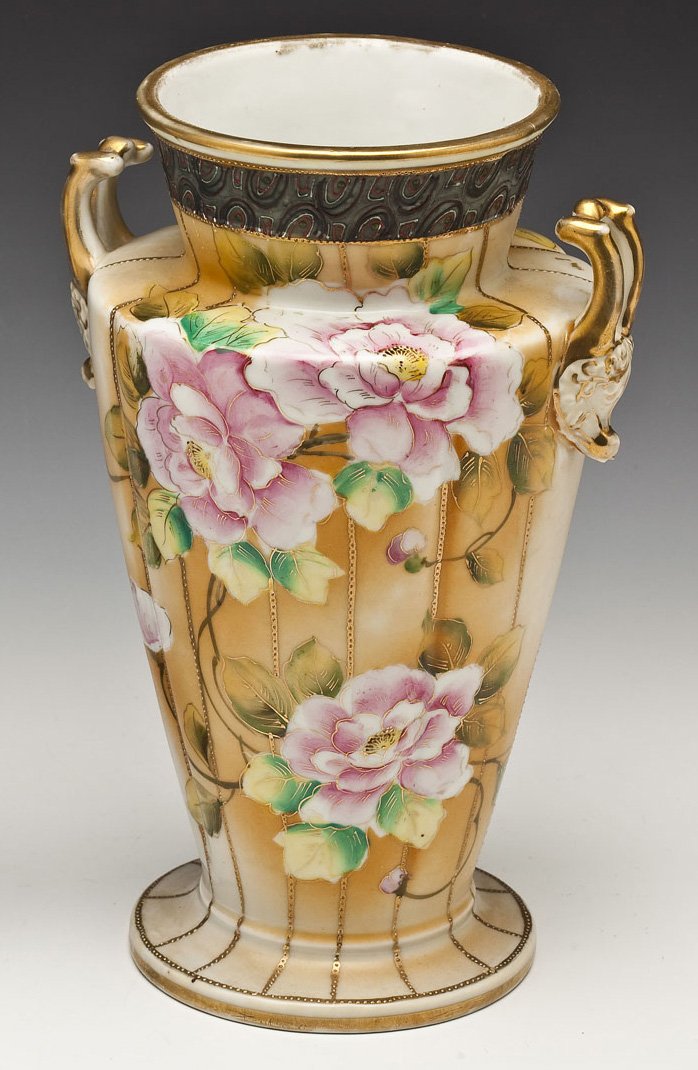 Large Nippon 2 Handled Vase: DESCRIPTION: Nippon two-handled vase of tapered cylindrical form. Decorated with handpainted flowers and enameling. Marked under base with Nippon mark and "Handpainted". Circa 1920 to 1940. MEASUREMEN