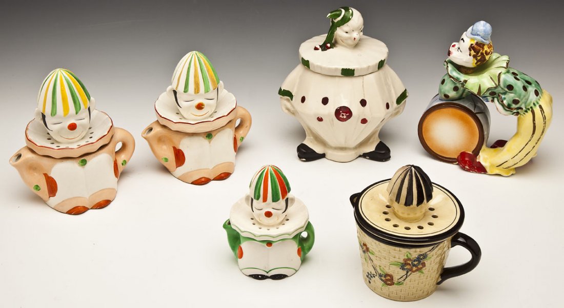 6 Ceramic Clown Vessels incl Reamers: DESCRIPTION: Group of six clown containers. Includes four reamers, all marked "Japan". One McCoy cookie jar. One figural decanter marked "Japan". MEASUREMENTS: 5-1/2" to 8-3/4" high. CONDITION: All wi