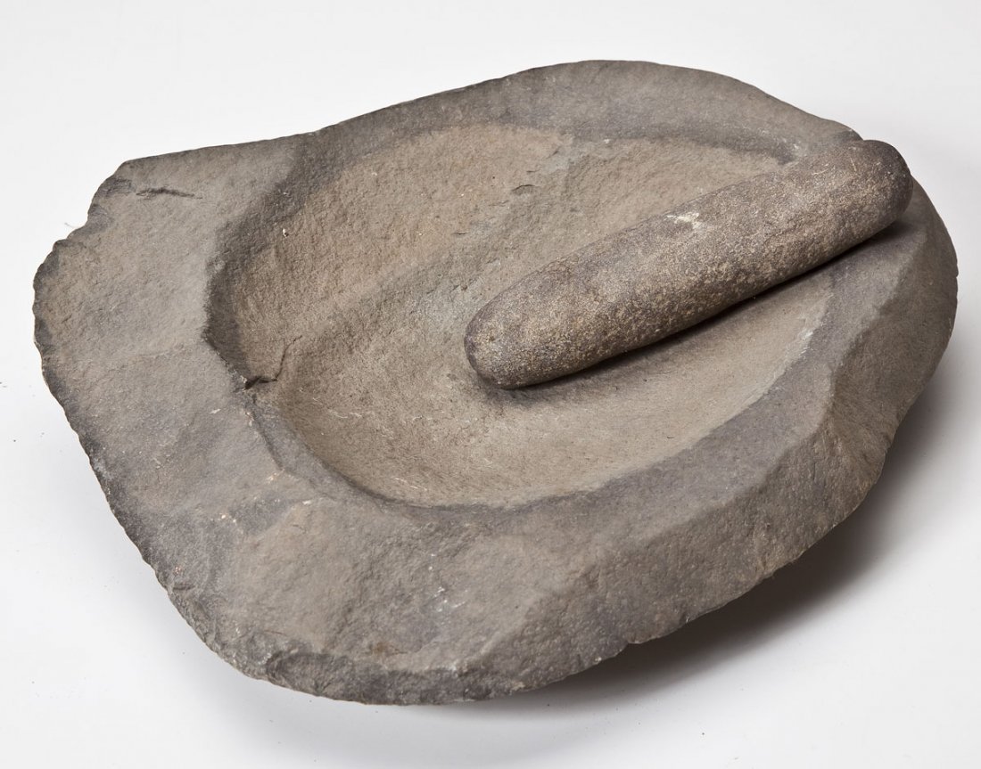 Large Stone Mortar & Pestle: DESCRIPTION: Large mortar with circular grinding area and double ended pestle/mano. MEASUREMENTS: Mortar 11" x 15". Pestle 7-1/2". CONDITION: Pestle shows expected wear to both ends with flat surface.