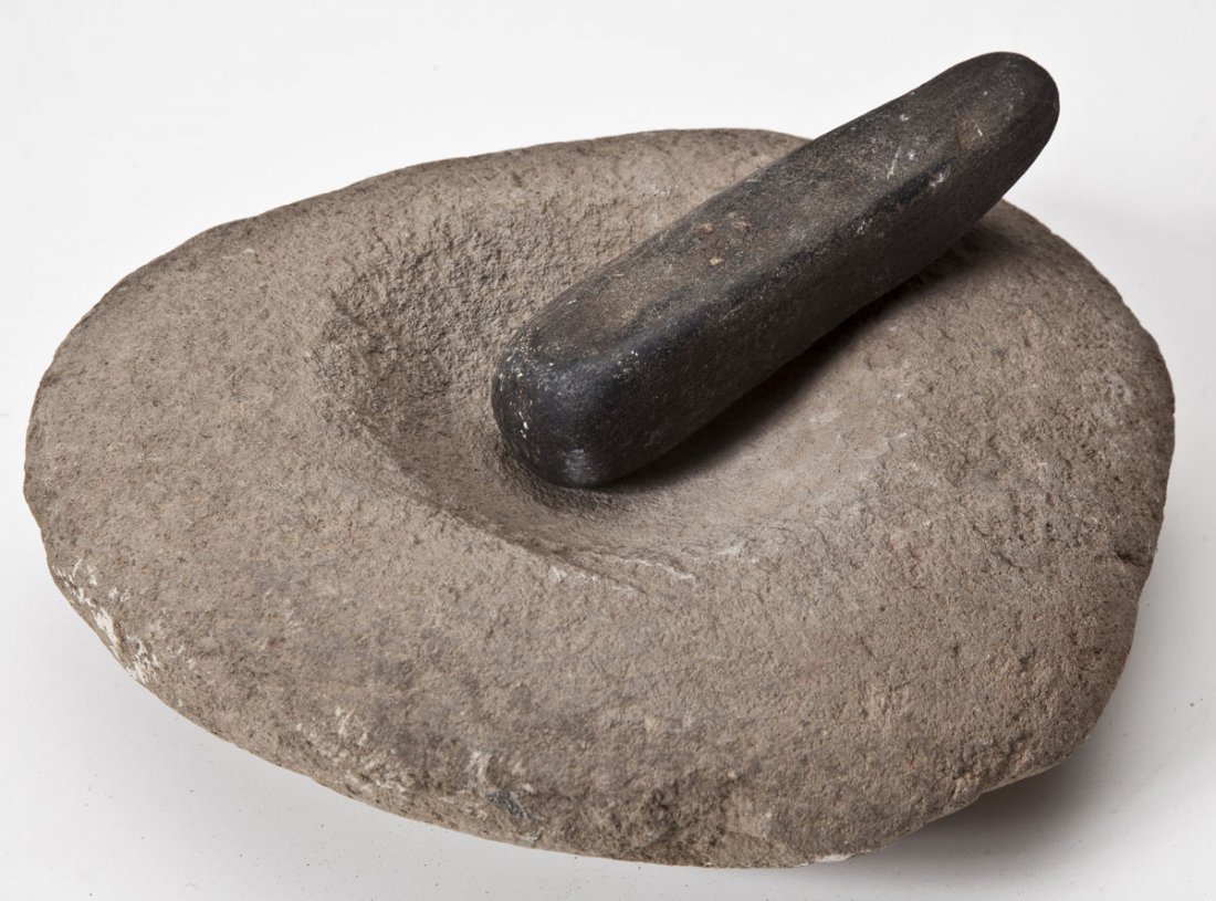 Large Stone Mortar & Pestle: DESCRIPTION: Mortar and pestle by association. Mortar with circular grinding area. Pestle showing evidence of additional use as a flat grinding stone. MEASUREMENTS: Mortar 11" x 10". Pestle 7". CONDIT