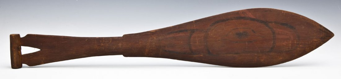 Northwest Coast Wood Raven Paddle: DESCRIPTION: Northwest Coast, Tlingit, carved wood dance paddle, each side painted with a raven in black and red. MEASUREMENTS: 24" long. CONDITION: Paint faded overall. Warm patina to wood.
