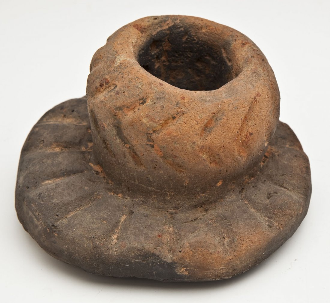 Mississippian Incised Vessel Georgia: DESCRIPTION: Mississippian vessel with small incised cup on a wide thick fluted base. Old paper label under base marked "Found in ruins of the last of the historic Rembert mounds on West Bank of Savan