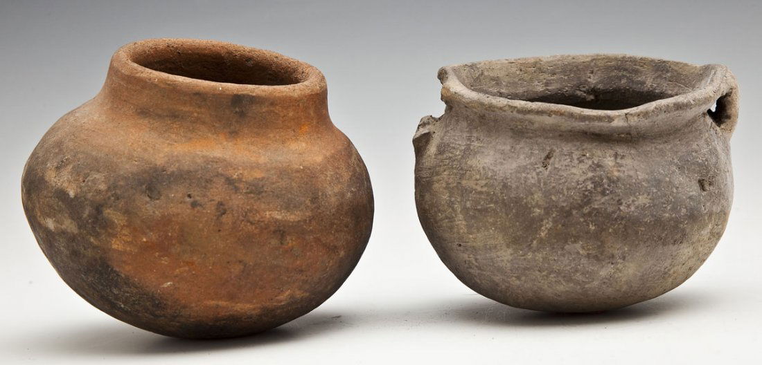 2 Small Mississippian Pots: DESCRIPTION: Two small Mississippian pots. 1) Small redware pot with fire-darkened exterior. 4-1/2" diameter x 4" high. 2) Small pot with two strap handles. Marked under base "1/17." 4-1/2" diameter x