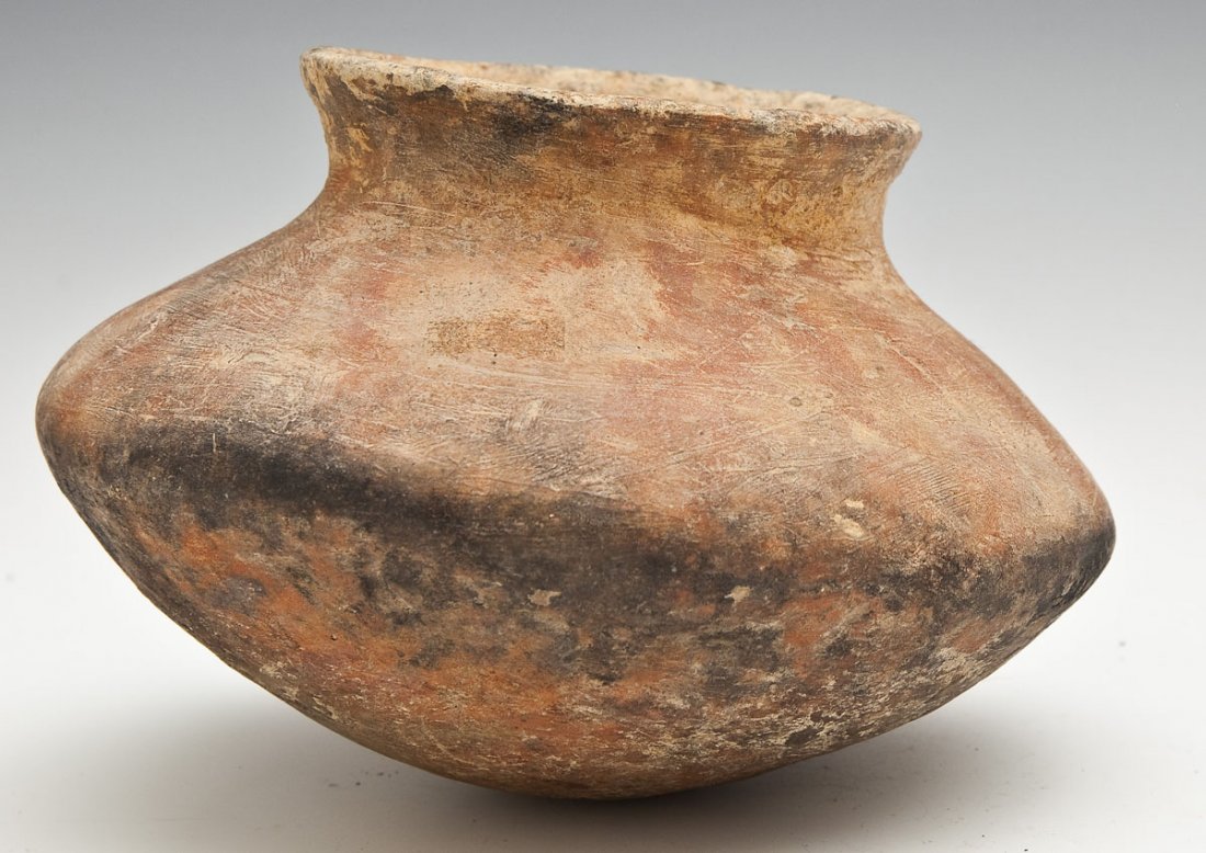 Mississippian Squat Pot Tennessee: DESCRIPTION: Mississippian squat pot with slightly flared rim. Paper included marked "Dr. Young Coll. Humphrey's Co.-Tenn. 5-6-1973." MEASUREMENTS: 6-1/4" diameter x 5" high. CONDITION: Wear as expect