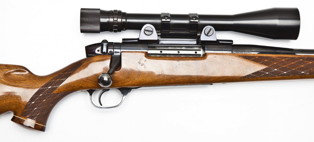 Weatherby Mark V Rifle - .300 Wby Mag.: SERIAL #: P13691 DESIGN: West German made bolt action with internal magazine and hinged floor plate. 24" barrel. MATERIAL/FINISH COMPOSITION: Blued steel. Wood Monte Carlo stock with checkered forearm