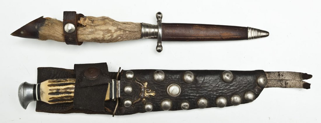 2 German Sheathed Knives: DESCRIPTION: Collection of two German made knives. Includes: 1) Double edged knife with deer hoof handle and leather sheath with metal toe. Blade stamped "ANTON WINGEN JR. / SOLINGEN GERMANY". 2) Stag