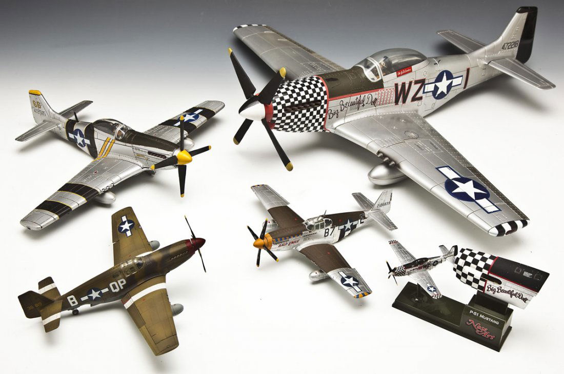 5 U.S. WWII P-51 Mustang Model Planes: DESCRIPTION: Five U.S. WWII P-51 Mustang model planes. Includes: 2 representative of Big Beautiful Doll, flown by Colonel J.D. Landers. One is a miniature on a stand, made by Nose Art, with an enlarge