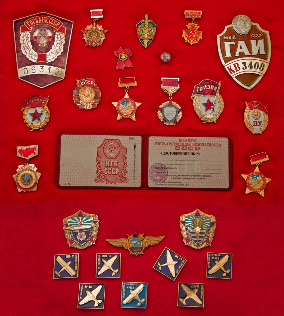 Collection of 25 Soviet Era Medals and Pins: DESCRIPTION: Collection of 25 Soviet era medals and pins in shadow boxes. One shadow box contains 15 medals with an open face ID wallet. Other shadow box contains 10 Commemorative Aircraft pins. MEASU