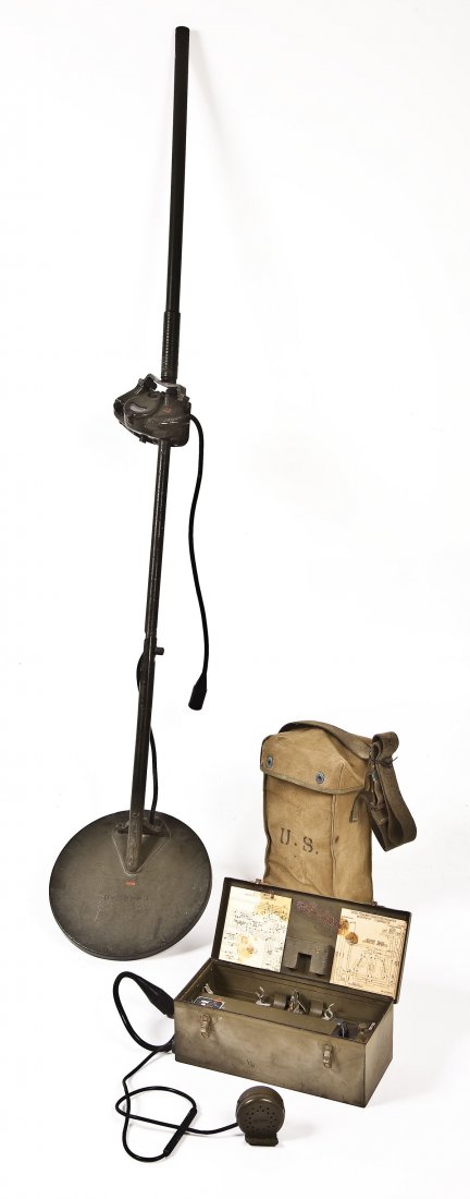 Signal Corps WWII Era Mine Detector: DESCRIPTION: Signal Corps WWII era mine detector with Signal Corps control box. Dated Dec. 1944. Includes battery pack, sweeper with pole, and speaker. MEASUREMENTS: Pole and sweeper approx. 70" long.