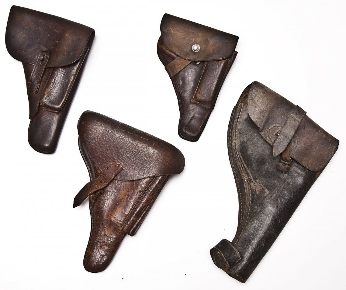 Collection of 4 World War Era Leather Holsters: DESCRIPTION: Collection of 4 World War era leather holsters. Used for service weapons during the period. MEASUREMENTS: Various. CONDITION: Holsters all show moderate wear with surface cracking to leat